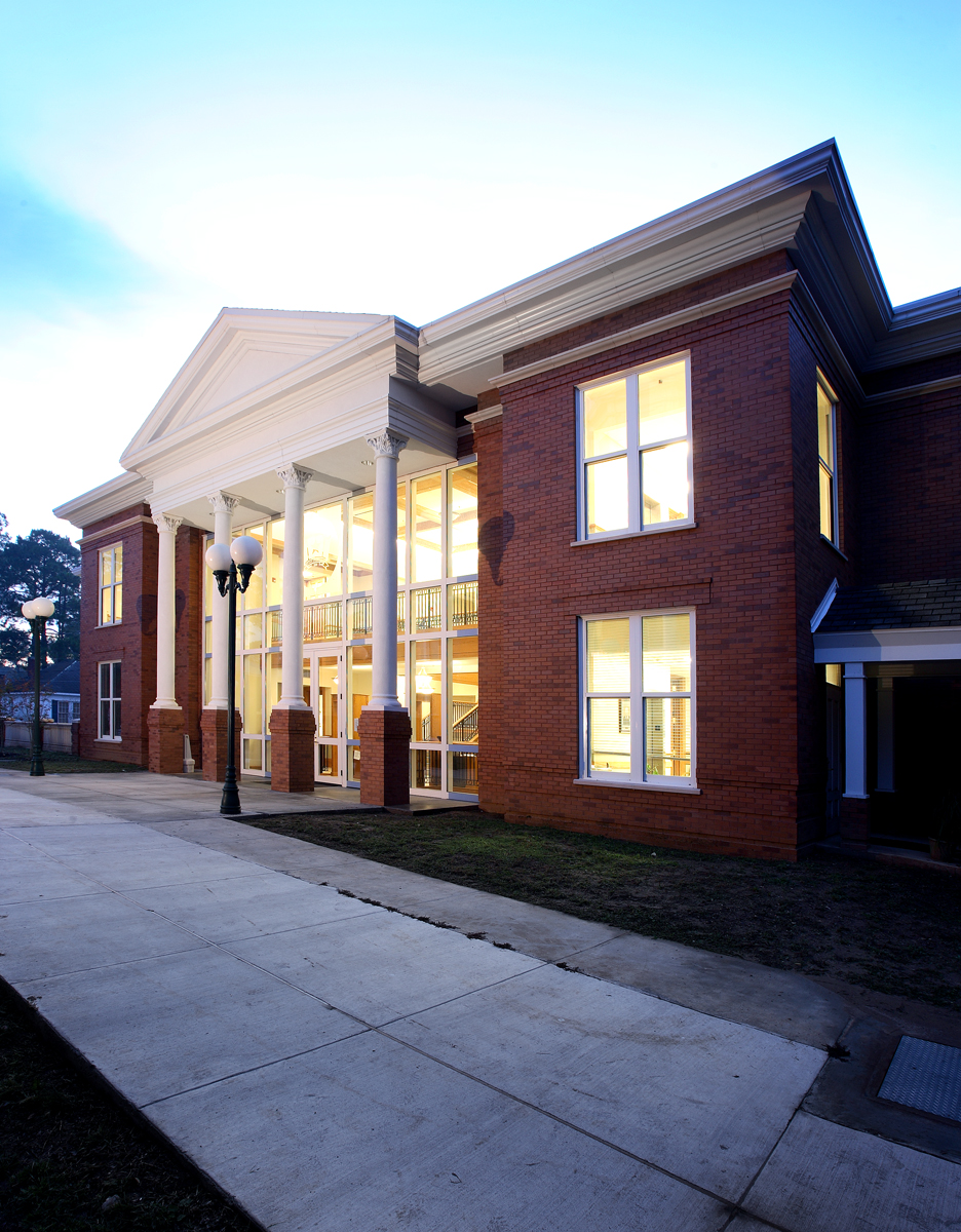 A sign pointing towards the West Feliciana Parish Clerk of Court's office.